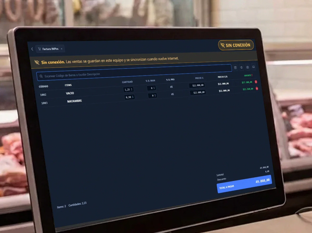 Monitor de una carnicería con la pantalla de venta de InfoManager marcando 'sin conexión', mientras la venta de vacío y matambre sigue en curso con su total a pagar.